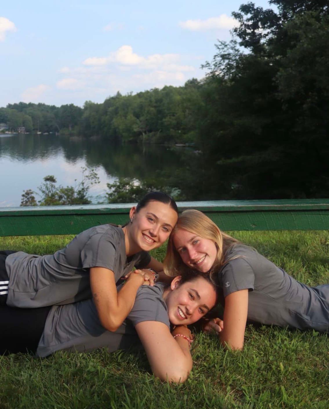 Susie McNamee and friends by the lake at camp